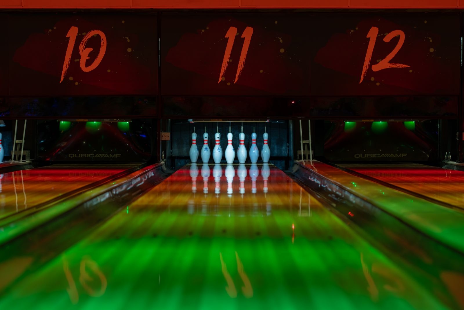 Dimly lit bowling alley at night